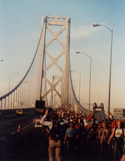 a gaggle of hikers on the bay bridge